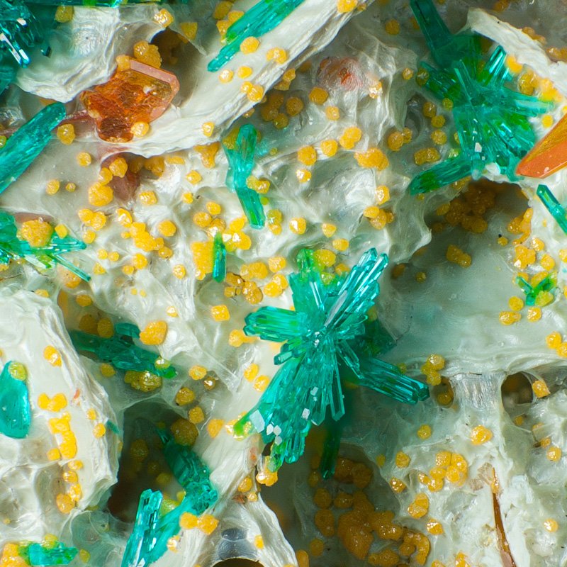 Dioptase, Wulfenite, Mimetite from Mammoth-Saint Anthony Mine, Pinal Co., AZ FOV 4.6 mm Copyright © 2025, Bruce J Kelley